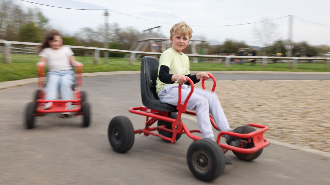 Kids play on some electric go karts at Newham Grange Farm